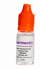 A 10ml bottle of Ivermectin antiparasitic treatment for small animals, featuring a clear bottle with a bright orange dropper cap and a white label with purple text.