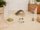 Portable hexagonal wire play pen for rabbits, guinea pigs and other small pets, designed for supervised exercise, cage extension or use as a temporary room divider.