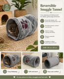 Rabbit resting inside a cosy reversible fabric tunnel in a comfortable indoor pet enclosure.